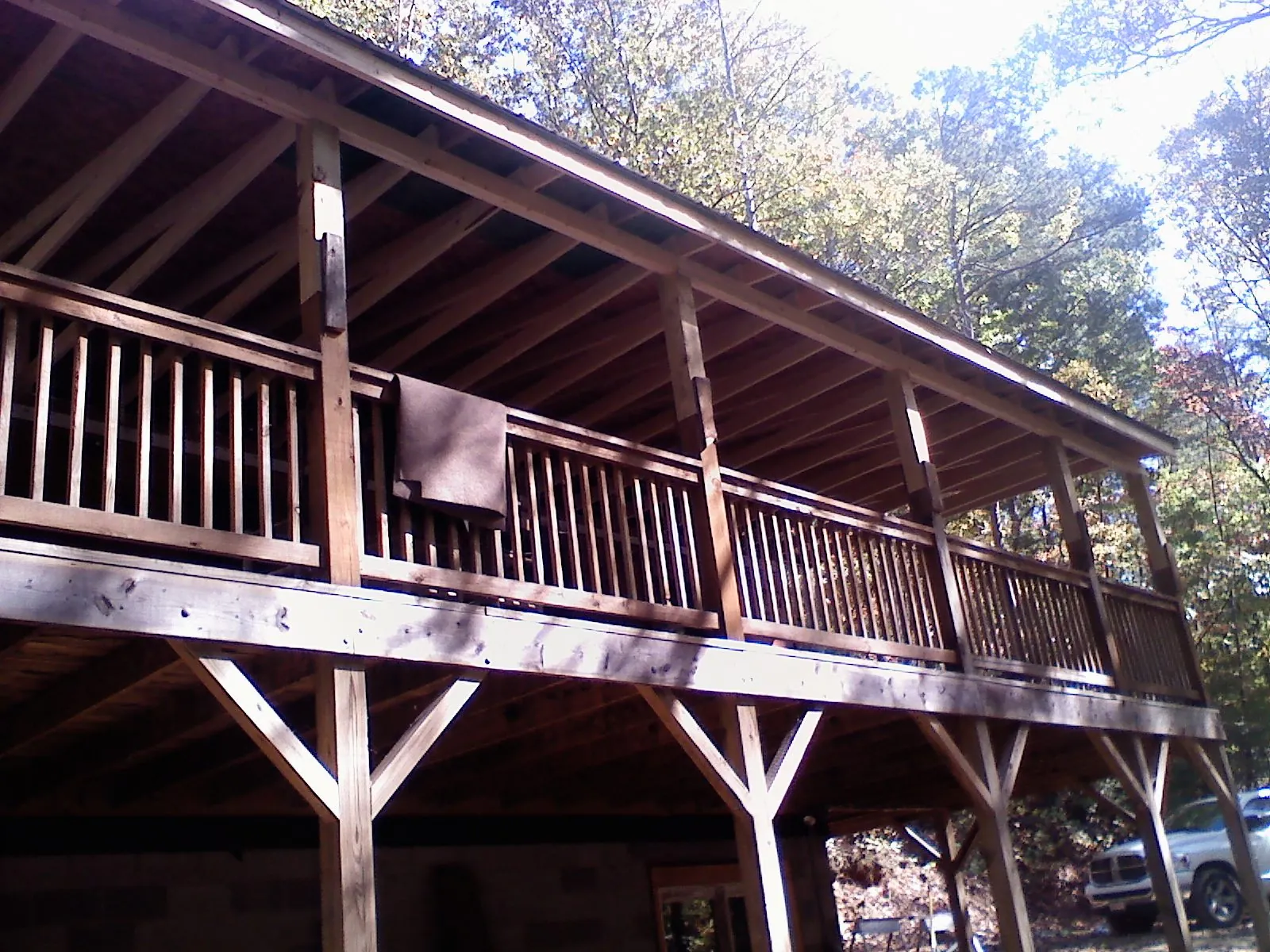 Timber framing under a new elevated porch and deck — Roof Leak Repair in Kittery Point by Roofing Brothers